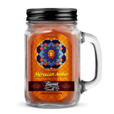 Scented Candle - Moroccan Amber in glass jar with black lid, featuring a label, offers 22-hour burn time and odor-neutralizing enzymes.