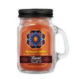 Scented Candle - Moroccan Amber in a glass jar with a black lid, featuring odor-neutralizing enzymes and a 22-hour burn time.