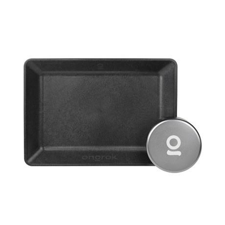 Eco-Tray & Storage Puck featuring a black, non-slip rectangular tray with a round silver aluminum puck for secure, eco-friendly, and portable storage.