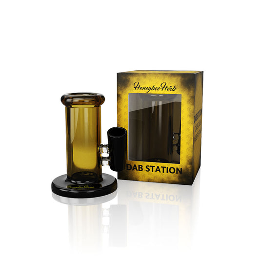 Glass Honeybee Herb Dabber Stand with designated spots for organizing dab tools and carb caps, showcasing sleek, durable design for a clutter-free setup.