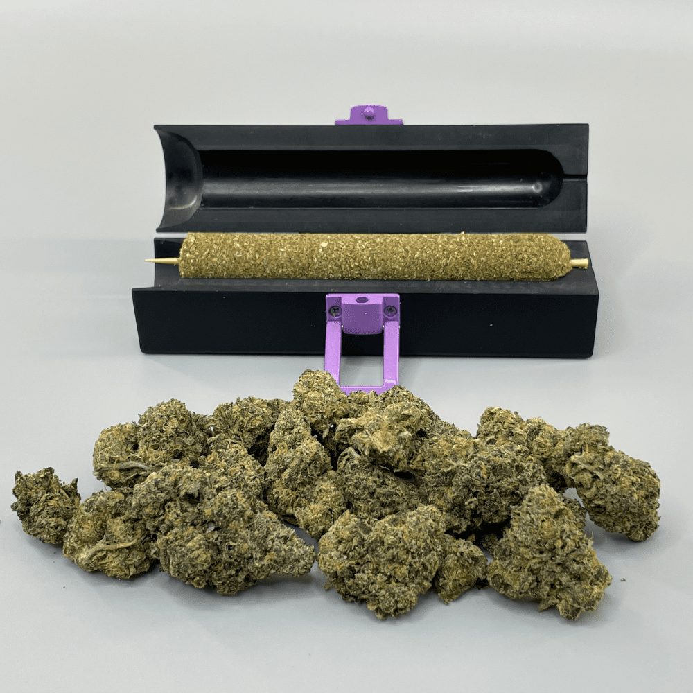 Large CannaMold for 7-14g, shown with a rolling machine and marijuana, ideal for creating dense, slow-burning cannagars with extended burn time and smooth hits.