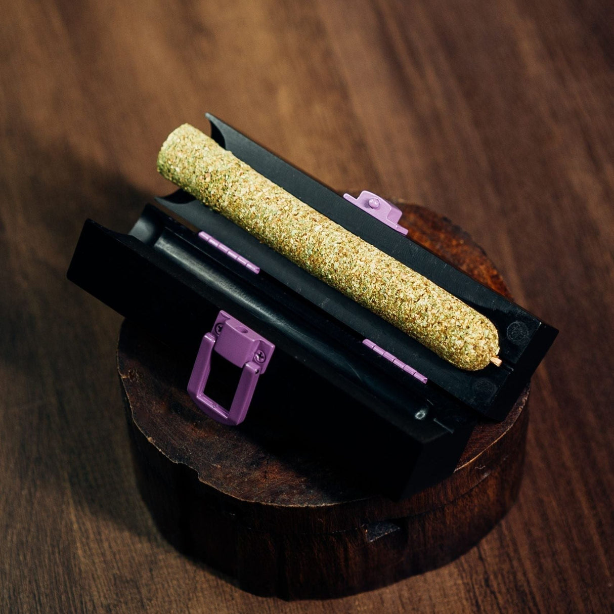 Large CannaMold - Fits 7-14g, shown with a rolled cannagar on a black case, highlighting its capacity for creating premium, slow-burning smoking experiences.