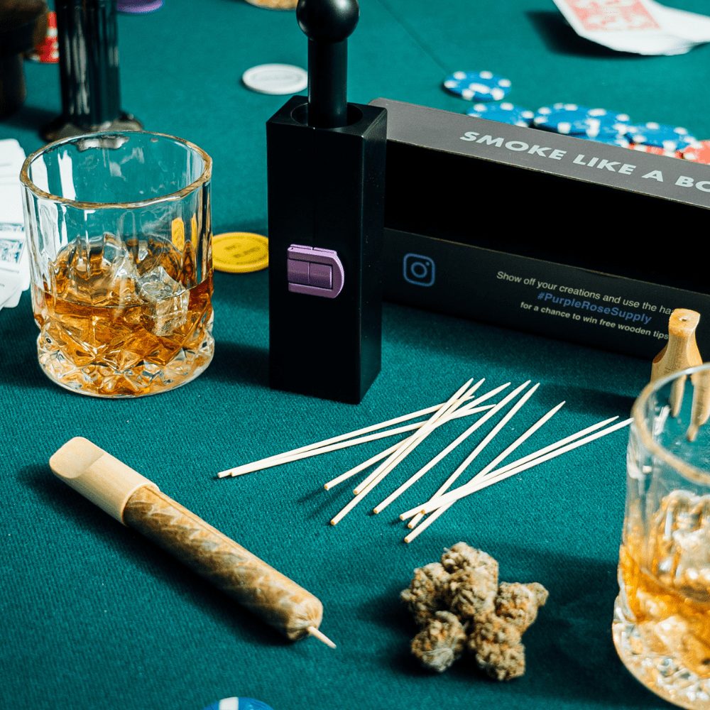 Large CannaMold - Fits 7-14g displayed on a table with drink and chips, emphasizing its role in crafting slow-burning, premium cannagars for extended smoking sessions.