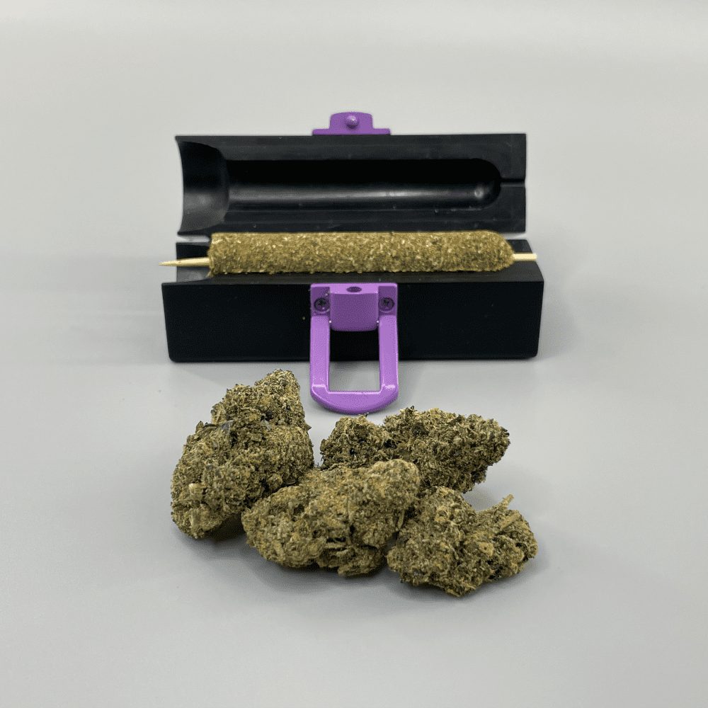 Small CannaMold - Fits 3.5-7g, displayed with a purple handle and screws, surrounded by marijuana buds, designed for creating slow-burning cannagars.