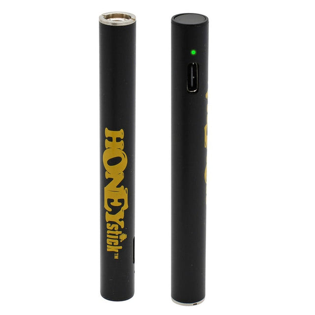 Auto Draw 510 Thread Battery - Black, featuring a sleek cylindrical design with a green light indicator and a prominent yellow HoneyStick logo on a matte black surface.