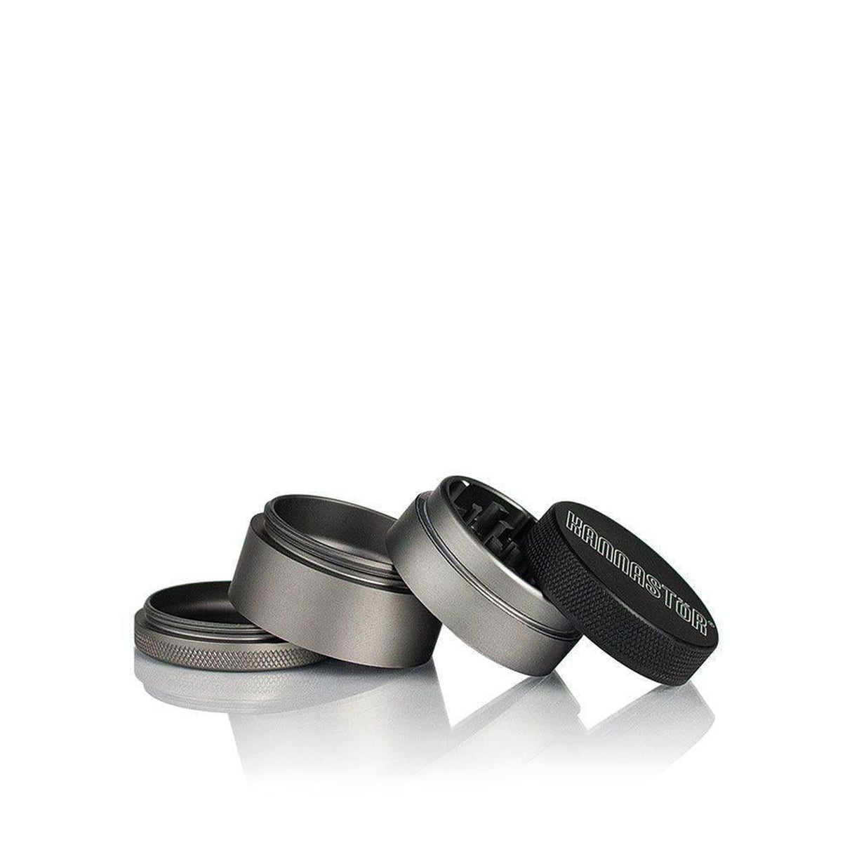 4pcs Aluminum 1.5 Solid Body Grinder with a magnetic lid, deep storage chamber, and precision design for efficient herb grinding, featured among metal objects.