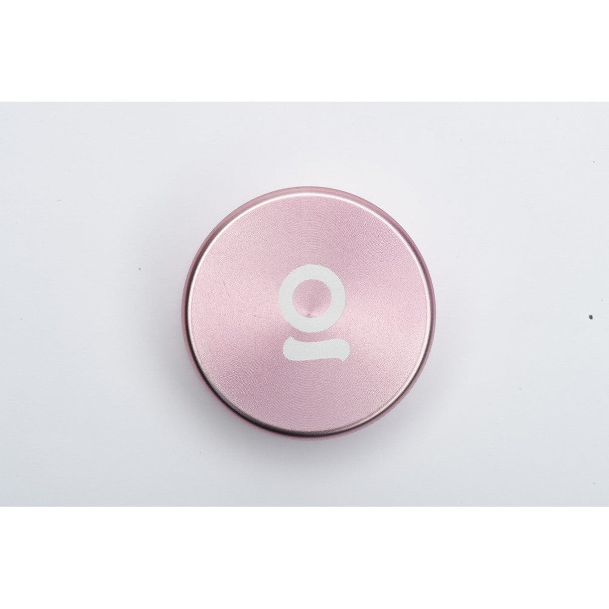 2pcs Metal 2 Magnetic Grinder featuring a sleek design with a central white logo, crafted from durable aircraft-grade aluminum for portable, efficient herb grinding.