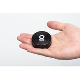 Hand holding the 2pcs Metal 2 Magnetic Grinder, showcasing its compact, round design and robust construction, ideal for efficient herb grinding.