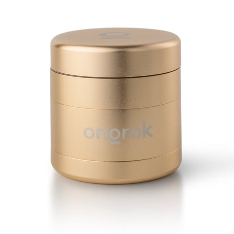 4pcs Aluminum 2.6 EZ Grinder with a gold container and round lid, showcasing its portable design and functionality for consistent herb grinding.