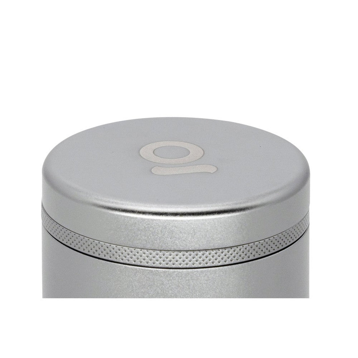 Close-up of the 5pcs Aluminum 3 Flower Petal Toothless Grinder, showcasing its sleek silver cylindrical design and intricate multi-chamber construction for efficient herb grinding.