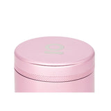 5pcs Aluminum 3 Flower Petal Toothless Grinder with Storage, showing a close-up of its pink cylindrical body and cap, highlighting its innovative design.