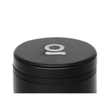 5pcs Aluminum 3 Flower Petal Toothless Grinder with Storage, featuring a sleek black cylinder design and a logo, highlighting its multi-chamber functionality for efficient herb grinding.