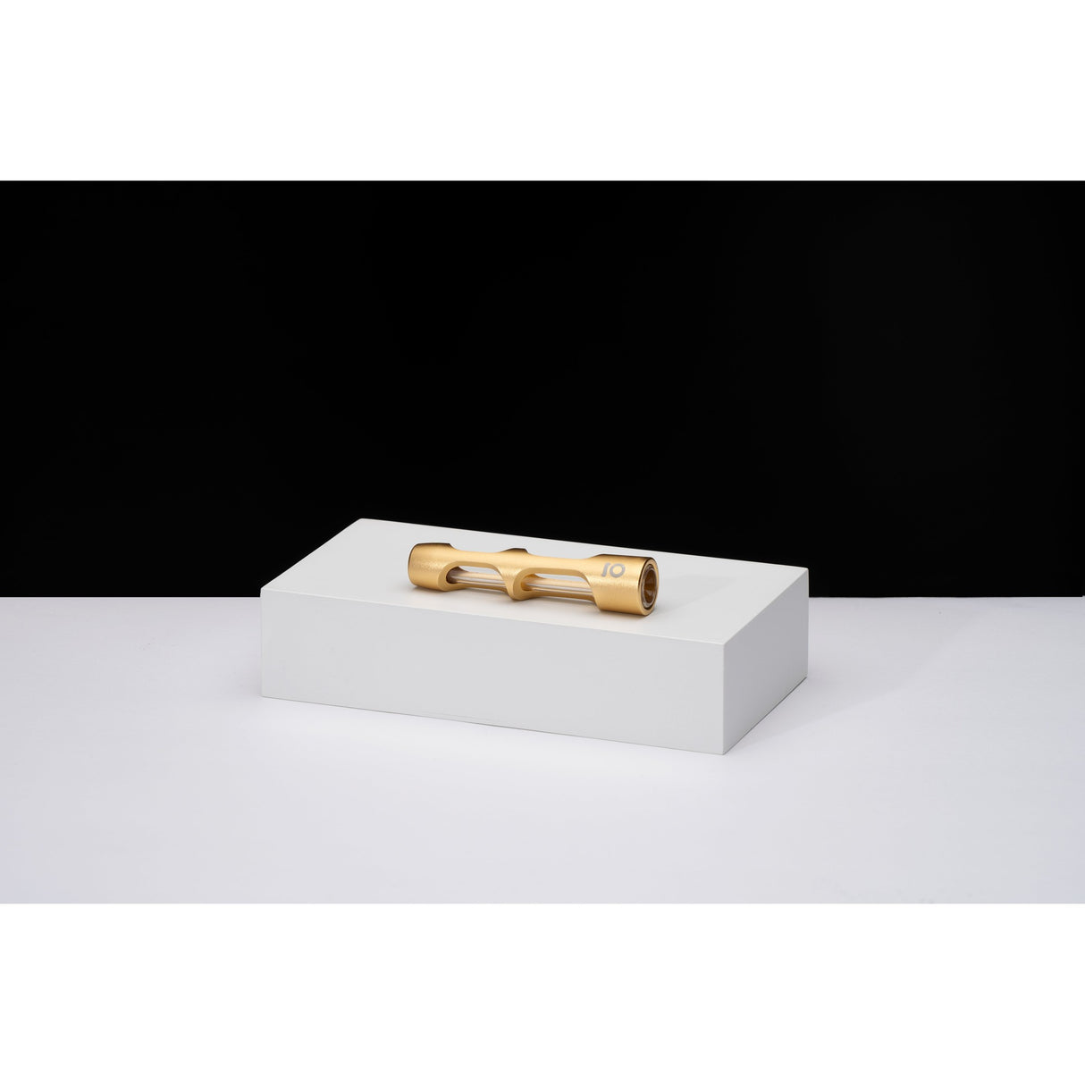 Aluminum & Glass Chillum One Hitter displayed in a gold tube on a white box, highlighting its sleek, portable design for discreet use.