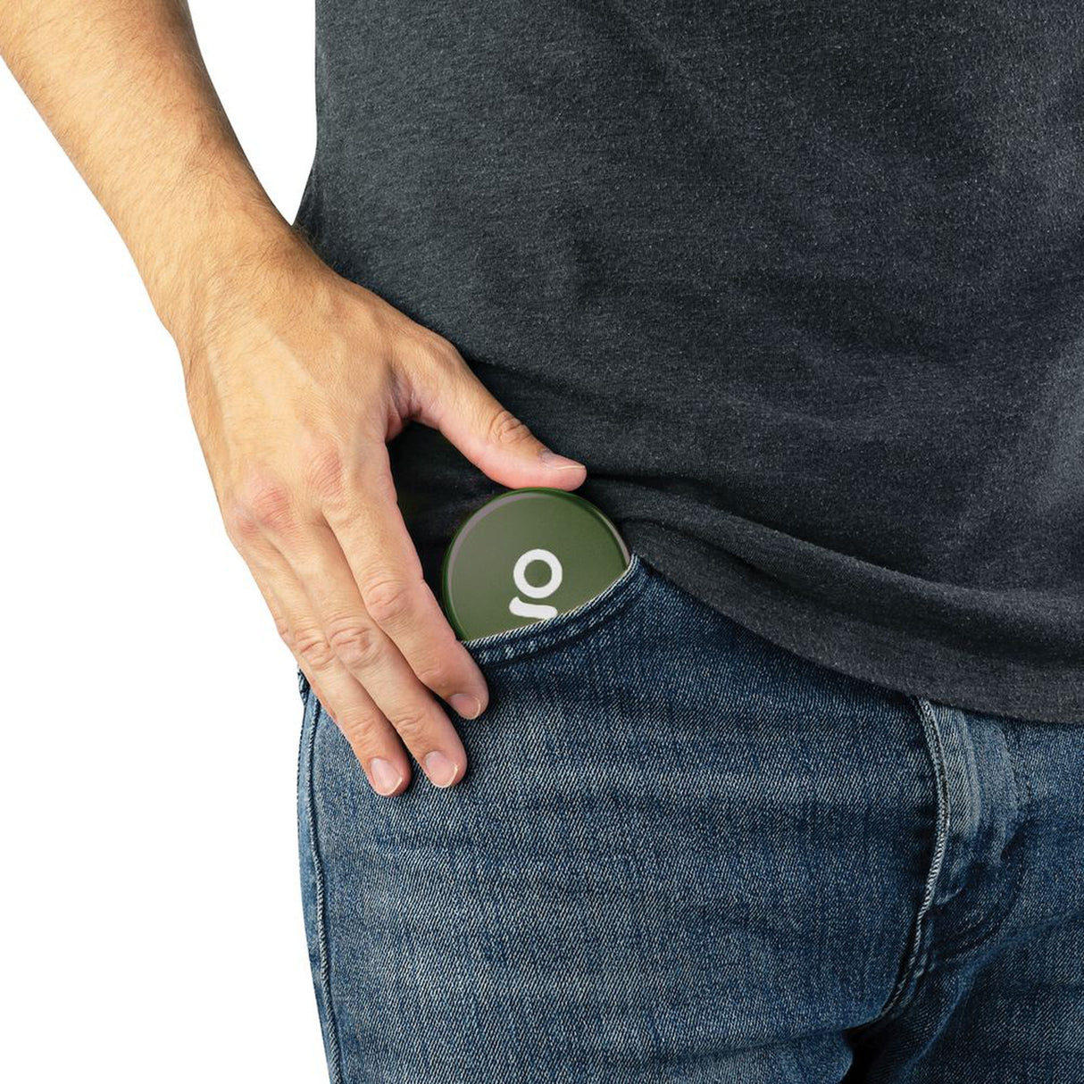 A person places an Aluminum Storage Puck into their denim pocket, showcasing its compact design ideal for discreet on-the-go storage.