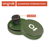 Aluminum Storage Puck, a pocket-sized, green metal container with a guitar pick on top, features an airtight seal ideal for discreet storage.