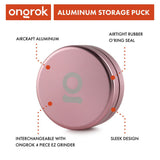 Aluminum Storage Puck, a round container with a logo, designed for discreet storage, featuring an airtight seal and compatibility with Ongrok EZ Grinder.