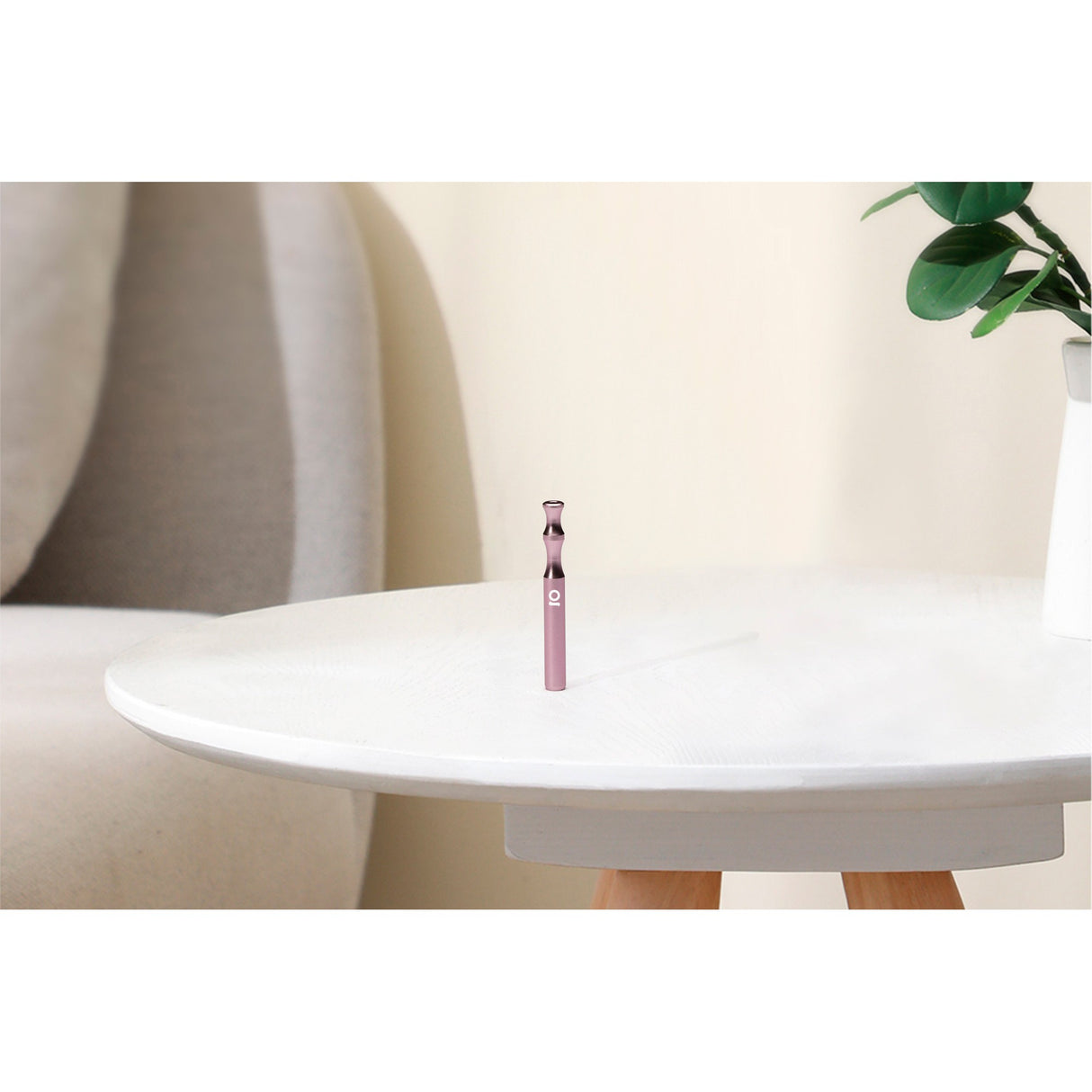 Aluminum Taster Bat, compact and durable, shown on a white table. Ideal for discreet smoking, crafted from high-quality anodized aluminum for portability and longevity.