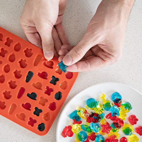 Silicone Gummy Molds & Dropper Kit - Set of 3, displayed with colorful candies being made, showcasing the ease and flexibility of the molds.