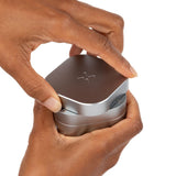 Person holding a 3pcs Aluminum 2.5 Grinder (Silver), showcasing its compact, ergonomic design and threadless magnetic closure for efficient herb grinding.