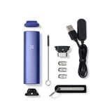 PAX Plus Dry Herb Vaporizer featuring flat and raised mouthpieces, standard and half-pack oven lids, with a charge cable and multi-tool visible.