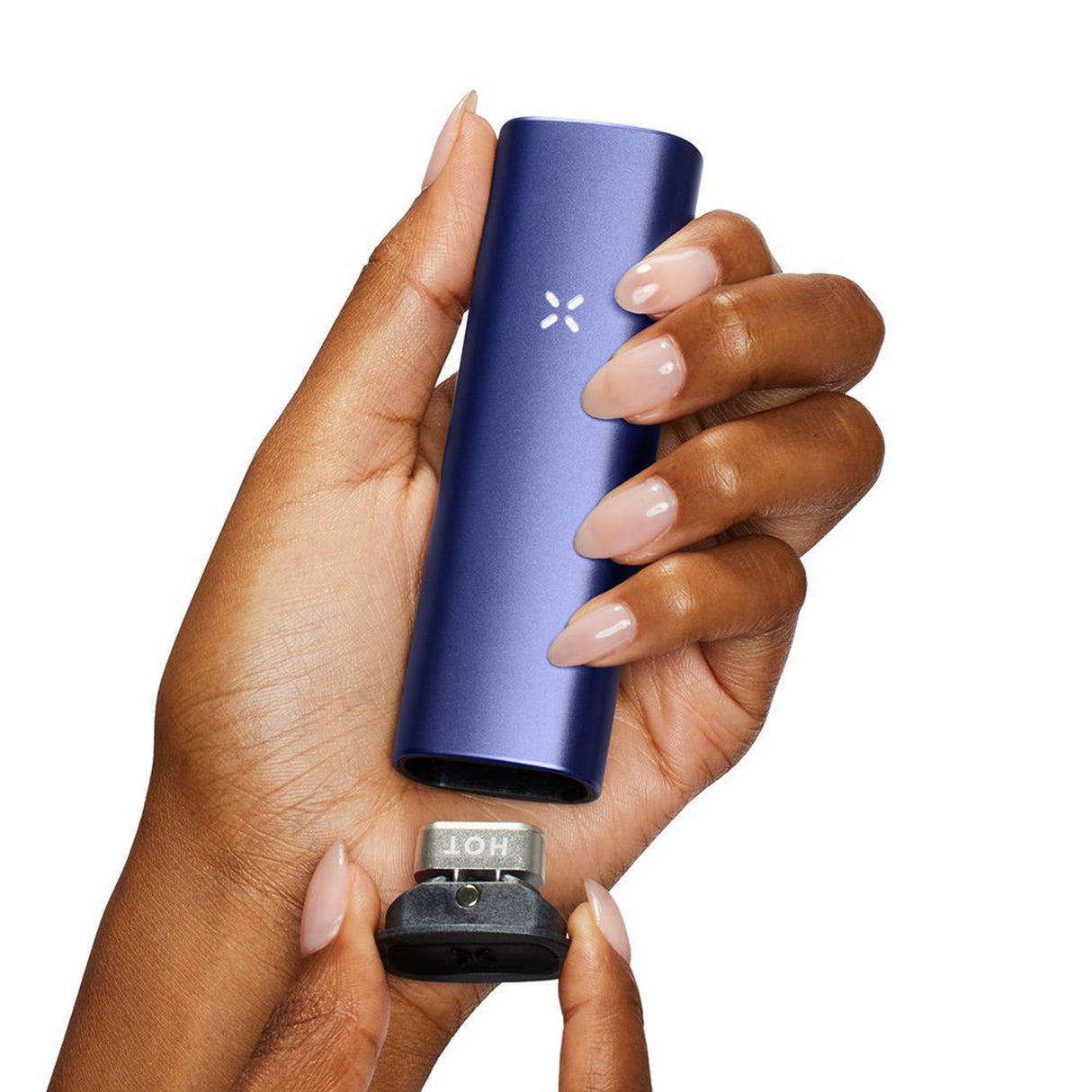 Hand holding PAX Plus Dry Herb Vaporizer, a sleek blue device with ergonomic design, ideal for on-the-go vaping.