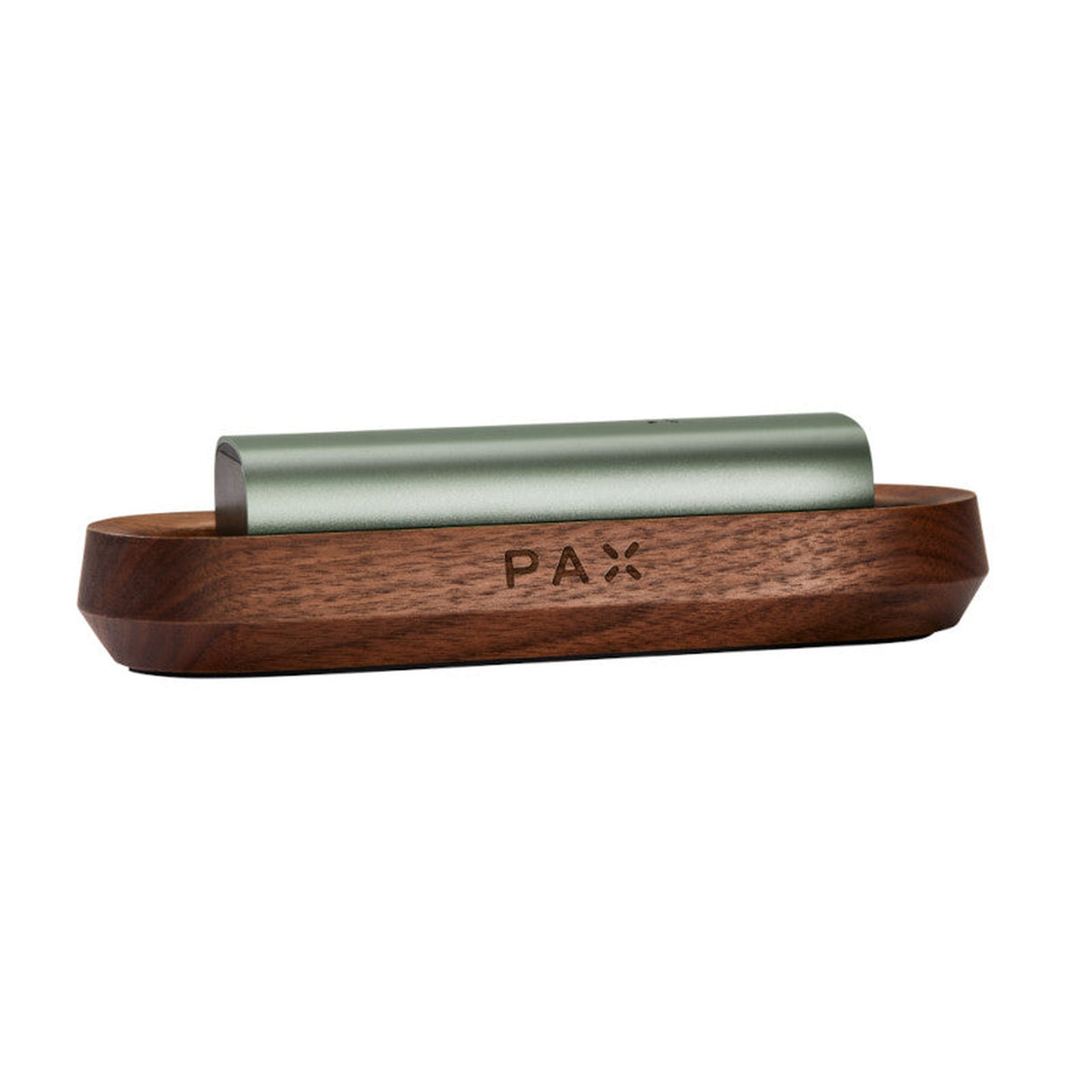 PAX Wood Charging Tray holding a green electronic cigarette, showcasing a sleek design crafted from premium wood for a sophisticated charging experience.