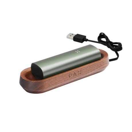 PAX Wood Charging Tray in a wooden case, featuring a green and black device holder. Designed for secure, stylish charging of PAX vaporizers.