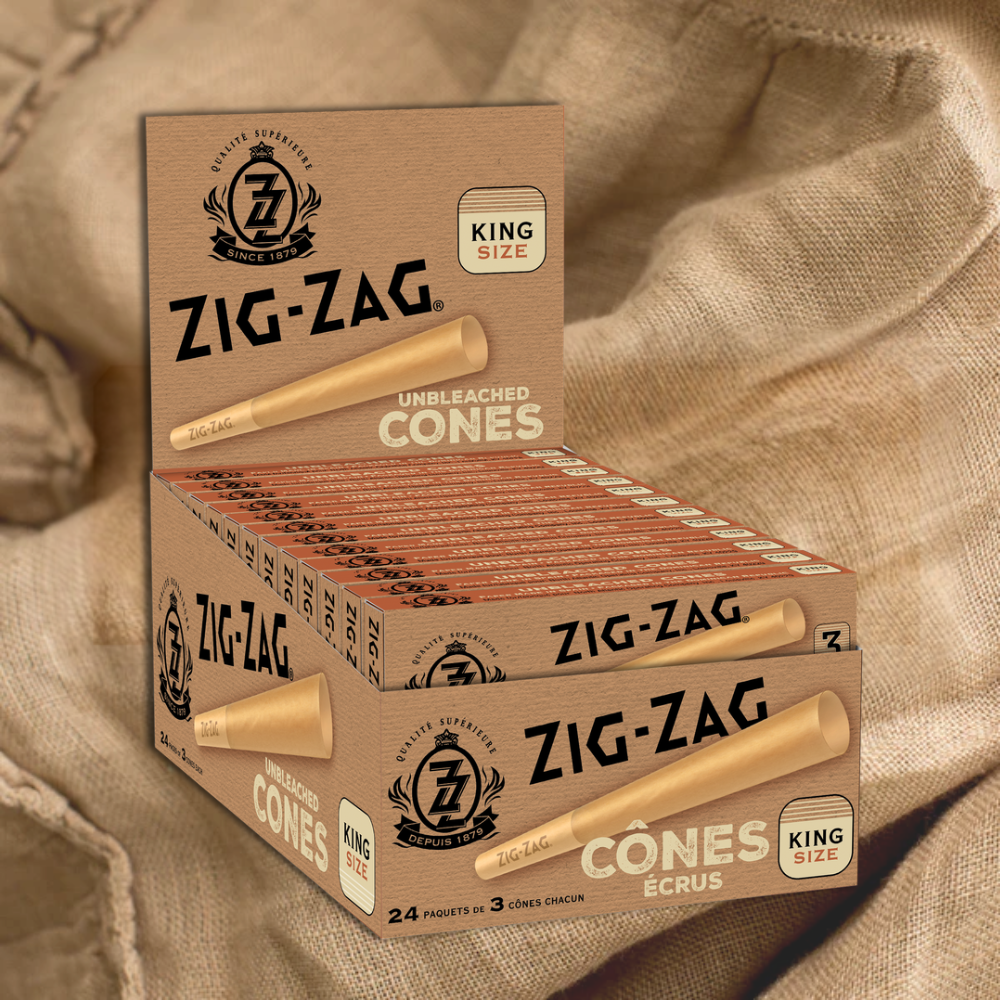 Pre Rolled Unbleached King Size Cones - Pack of 3, in a crush-proof slide box, displayed on a cloth, highlighting ease of use and premium design.