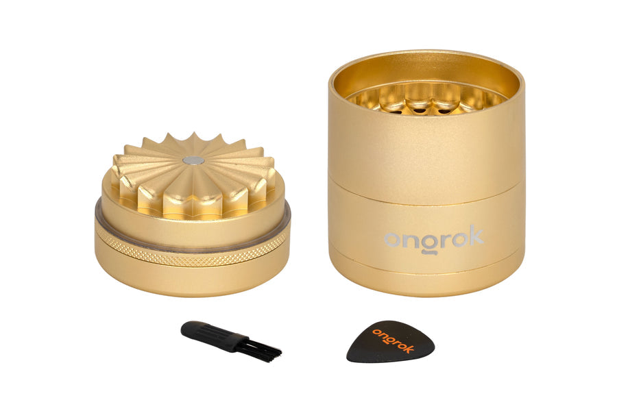 Mini 5 Piece Flower Petal Toothless Grinder with Storage - Black, featuring a gold cylinder design, black brush, and airtight storage for consistent, fine grinding.