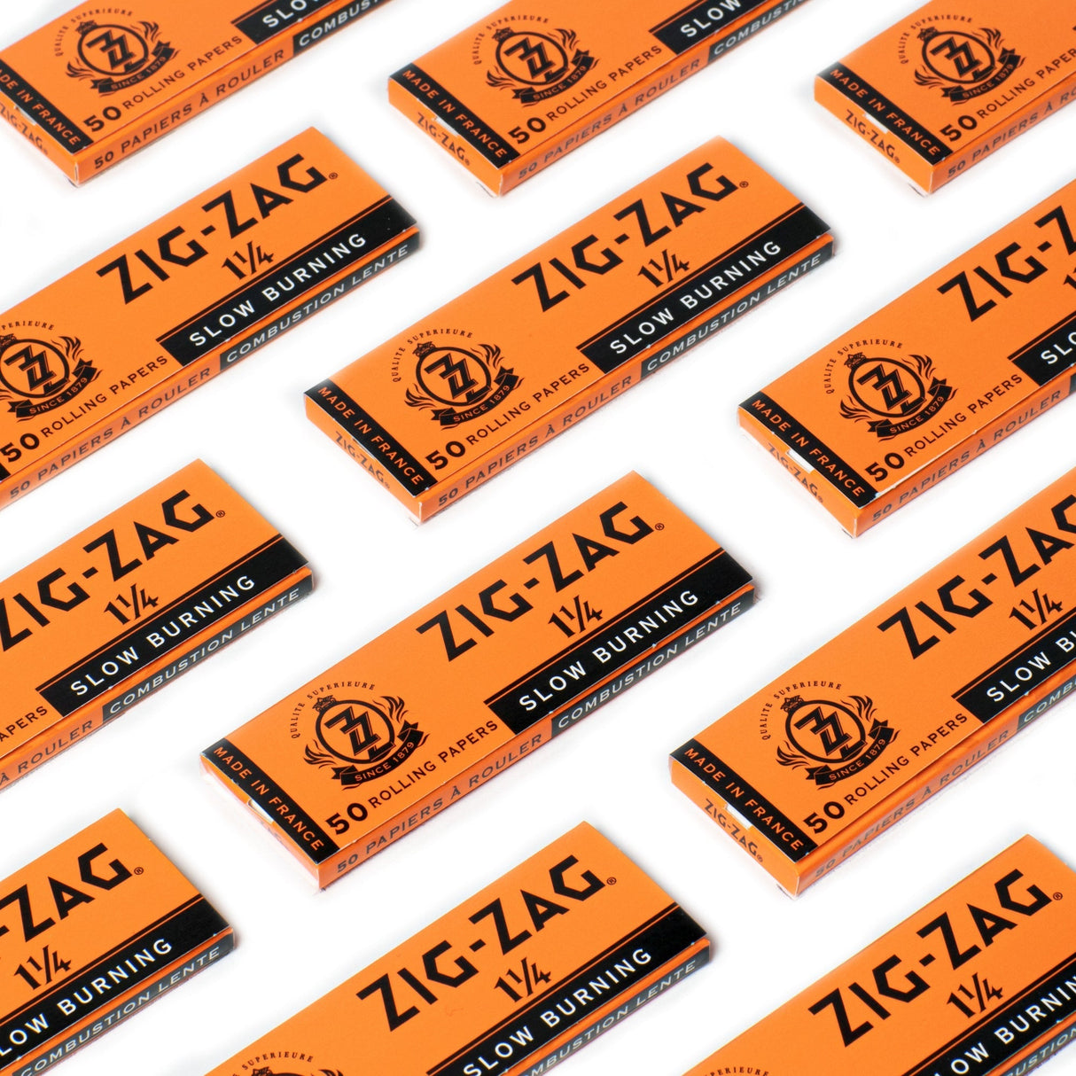 1 1/4 Orange Rolling Paper pack, close-up, showcasing smooth, slow-burning, natural flax fibers for a premium rolling experience with 50 papers per booklet.