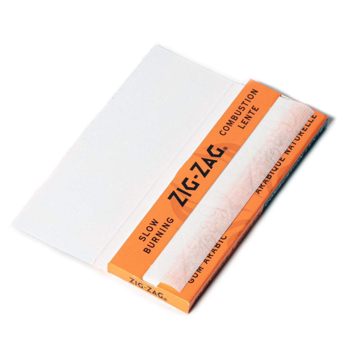 Close-up of Zig-Zag 1 1/4 Orange Rolling Paper booklet, showcasing premium natural flax fibers for a smooth, slow-burning smoking experience.