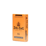 Zig-Zag 1 1/4 Orange Rolling Paper, displayed in its packaging, known for slow burn and natural flax fibers, ideal for a smooth, consistent rolling experience.