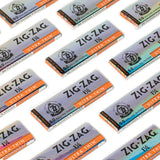 1 1/4 Ultra Thin Rolling Paper packs, showcasing Zig-Zag's translucent, lightweight design for a superior, slow-burning smoking experience, emphasizing durability and elegance.