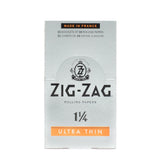 Zig-Zag 1 1/4 Ultra Thin Rolling Paper, featuring a white box with a black logo, known for its slow-burn, translucent design and durability.