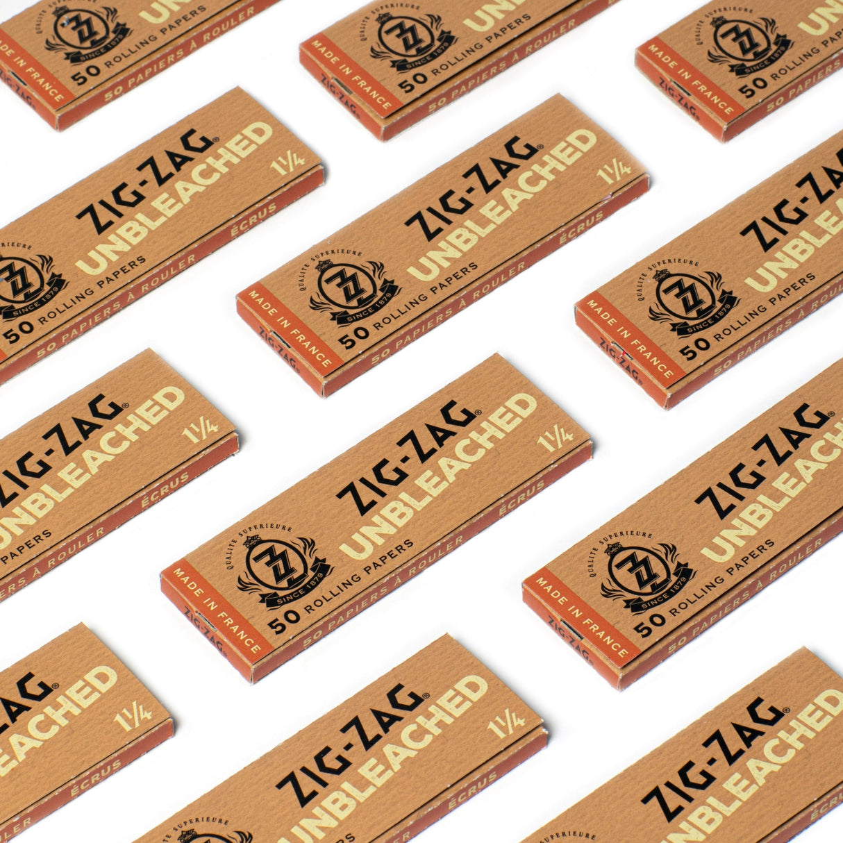 1 1/4 Unbleached Rolling Paper boxes, featuring black text, showcasing Zig-Zag's natural, ultra-thin, slow-burning joint papers made from unbleached fibers.