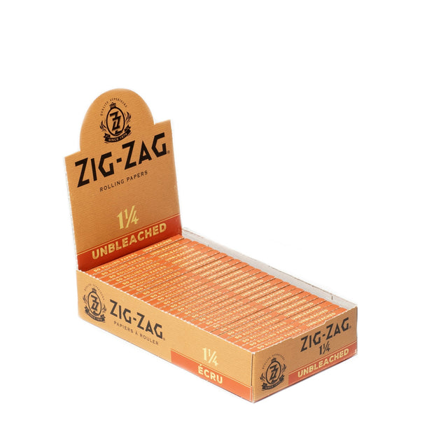 1 1/4 Unbleached Rolling Paper box close-up, featuring ultra-thin, slow-burning Zig-Zag joint papers made from natural, unbleached fibers for a premium smoking experience.