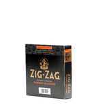 Zig-Zag King Slim Rolling Papers in a black box, featuring gold text and logo, ideal for extended sessions with superior size and quality.