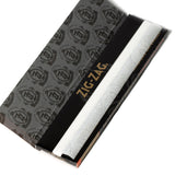 Zig-Zag King Slim Rolling Papers, featuring a logo on its black and white box, designed for extended smoking with premium quality and size.