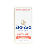 Single Wide White Kutcorners Rolling Paper in a white box, featuring blue and red text with a white and gold logo, highlighting Zig-Zag's iconic design.