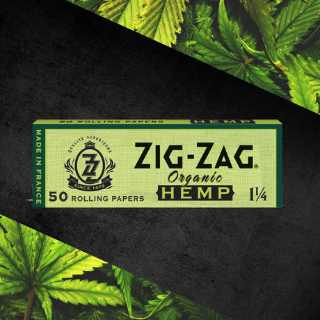 1 1/4 Hemp Rolling Paper box with green leaves design, highlighting organic hemp fibers for a natural, eco-friendly smoking experience.