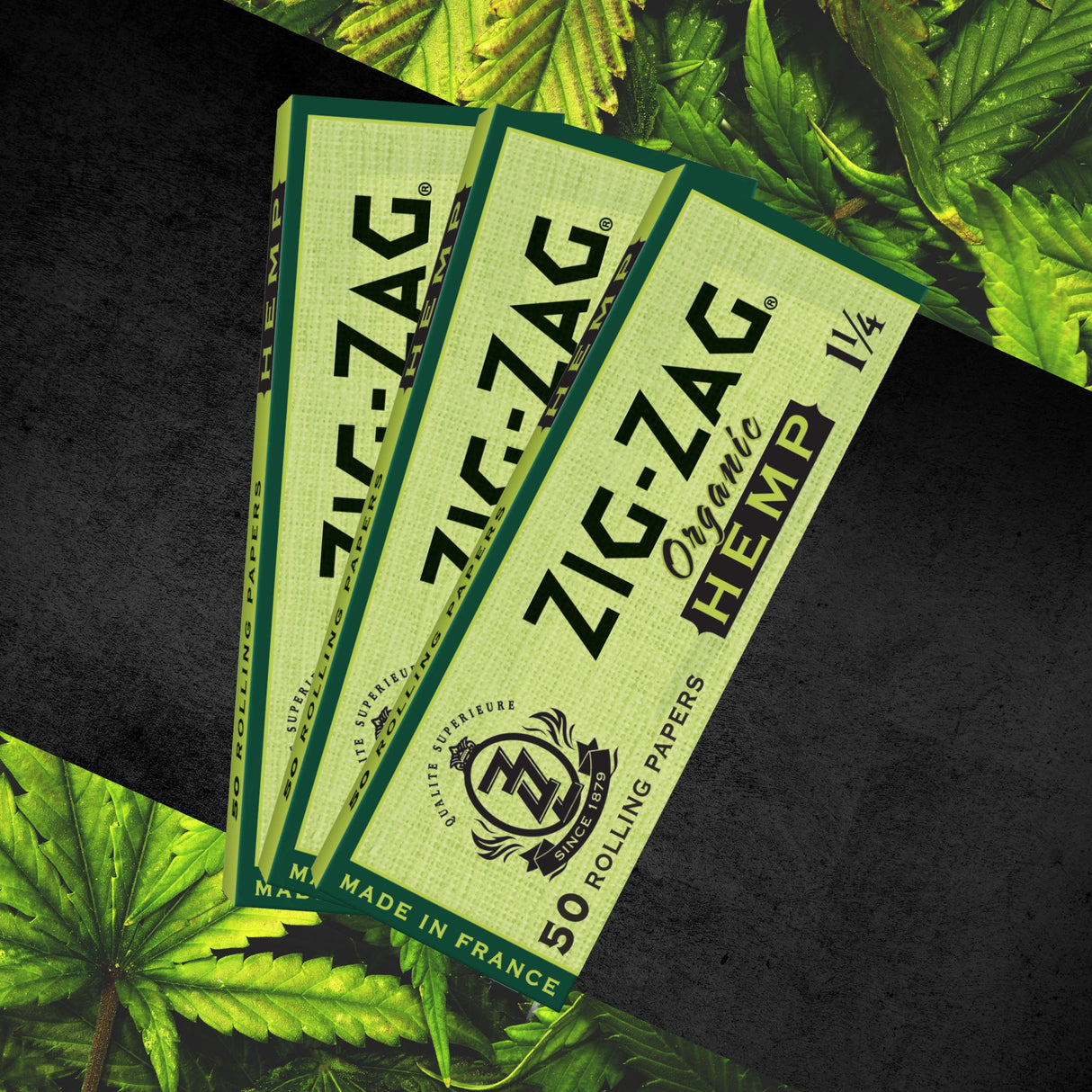 1 1/4 Hemp Rolling Paper, featuring organic, unbleached hemp fibers, stacked in green booklets, ideal for a clean, sustainable smoking experience.