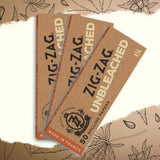 1 1/4 Unbleached Rolling Paper stack, showcasing Zig-Zag's logo, highlighting strength and ultra-thinness for a premium, eco-friendly smoking experience.