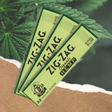 King Slim Hemp Rolling Paper featuring green rectangular sheets with black text, emphasizing organic hemp for a smooth, sustainable smoking experience.