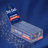 Single Wide Blue Rolling Paper with Zig-Zag branding, showing kutcorner design for easy rolling and faster burn, in a close-up view of the packaging.