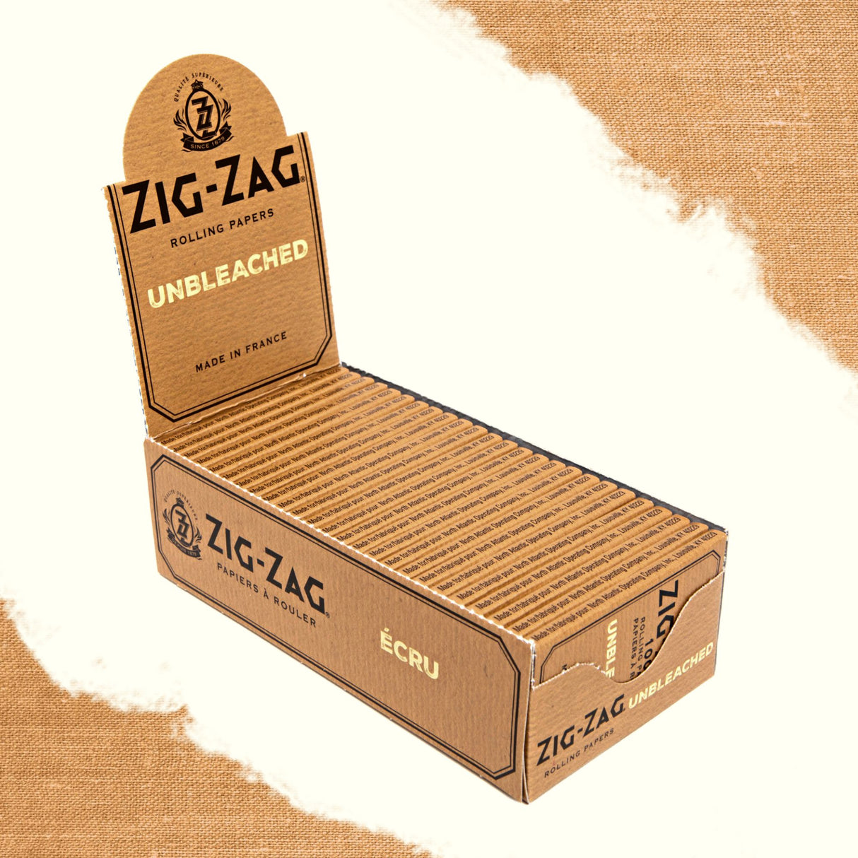 Single Wide Zig-Zag Unbleached Rolling Paper displayed in an open cardboard box, highlighting its natural and eco-conscious packaging.